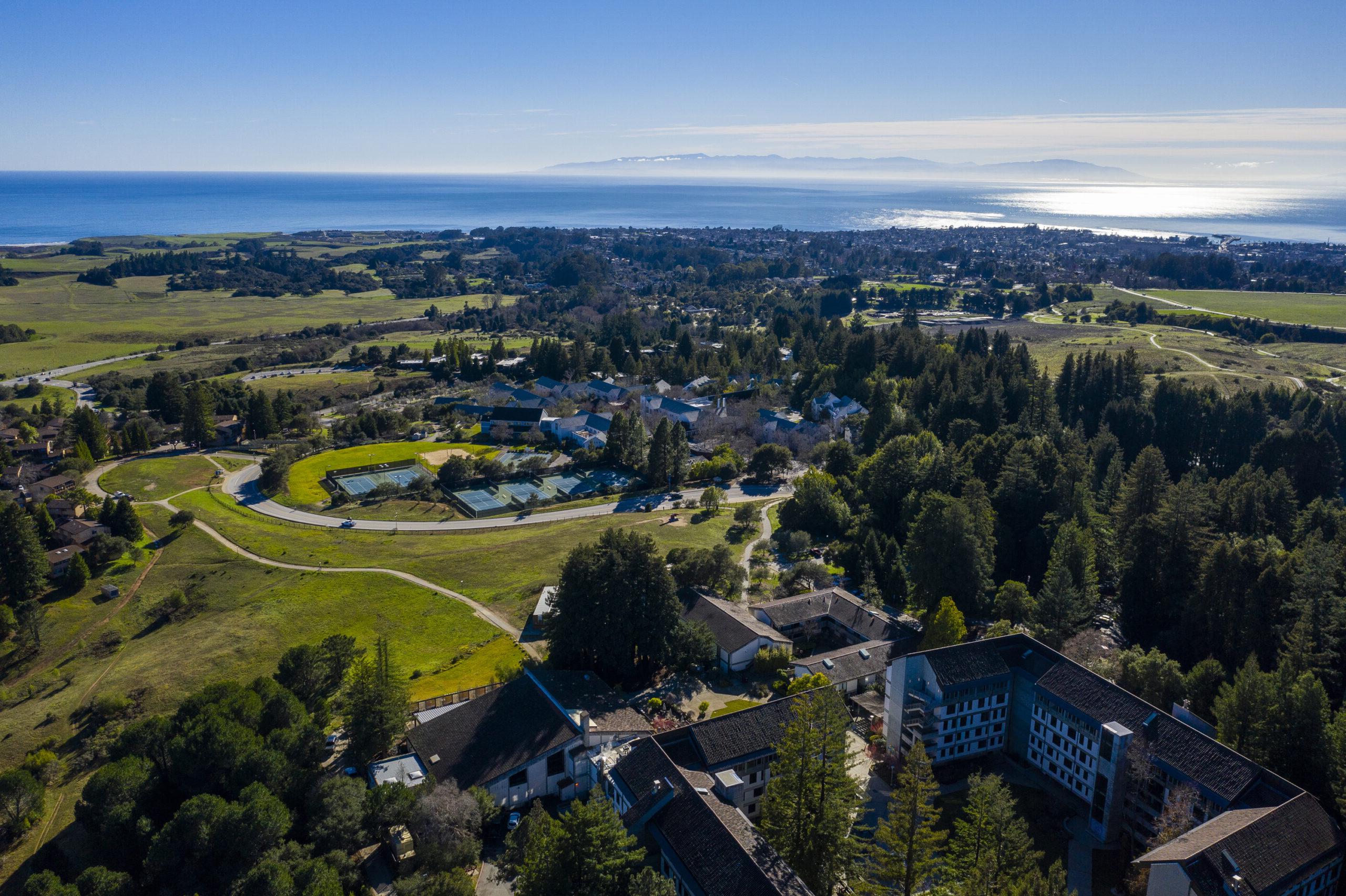 Aerial shot of campus with Monterey Bay in the background.