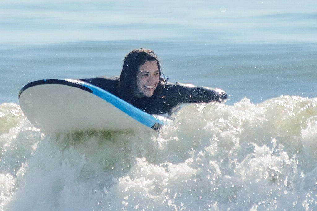 Person learning to surf.